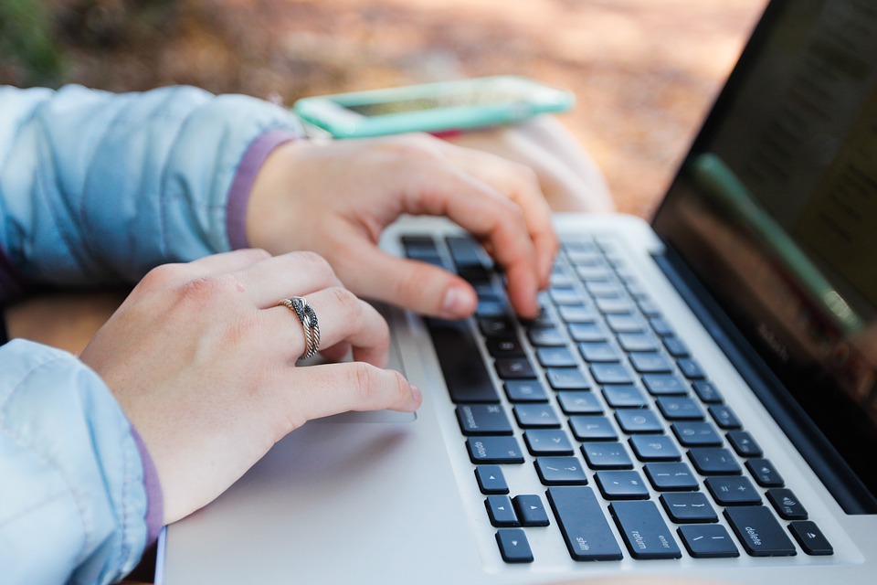 Hands using a laptop