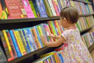 Young girl choosing a book