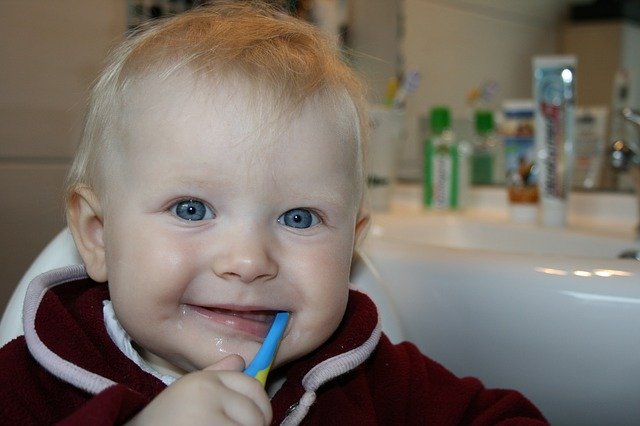 Young child brushing teeth