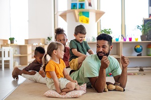Adult playing with children