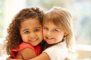 Two girls hugging each other