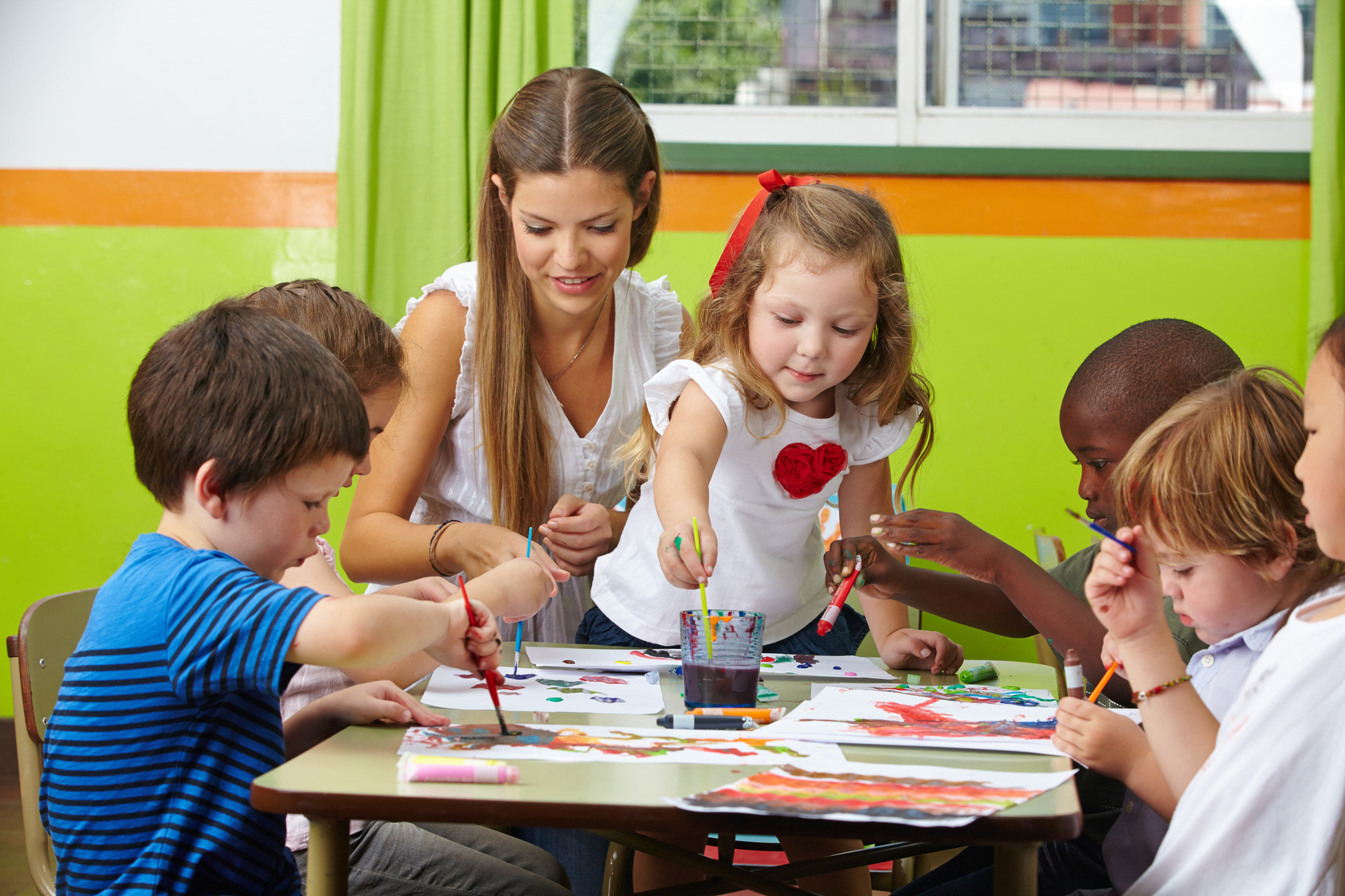 Children painter at a table