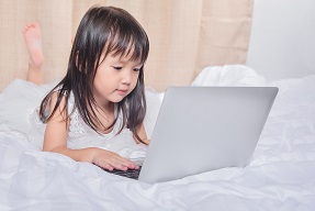 Young girl using a laptop
