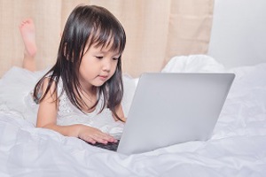 Young girl using a laptop