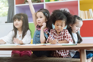 Group of kids at a desk