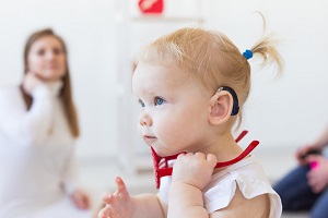 Toddler girl with hearing aid