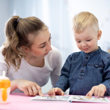 Adult reading with young child