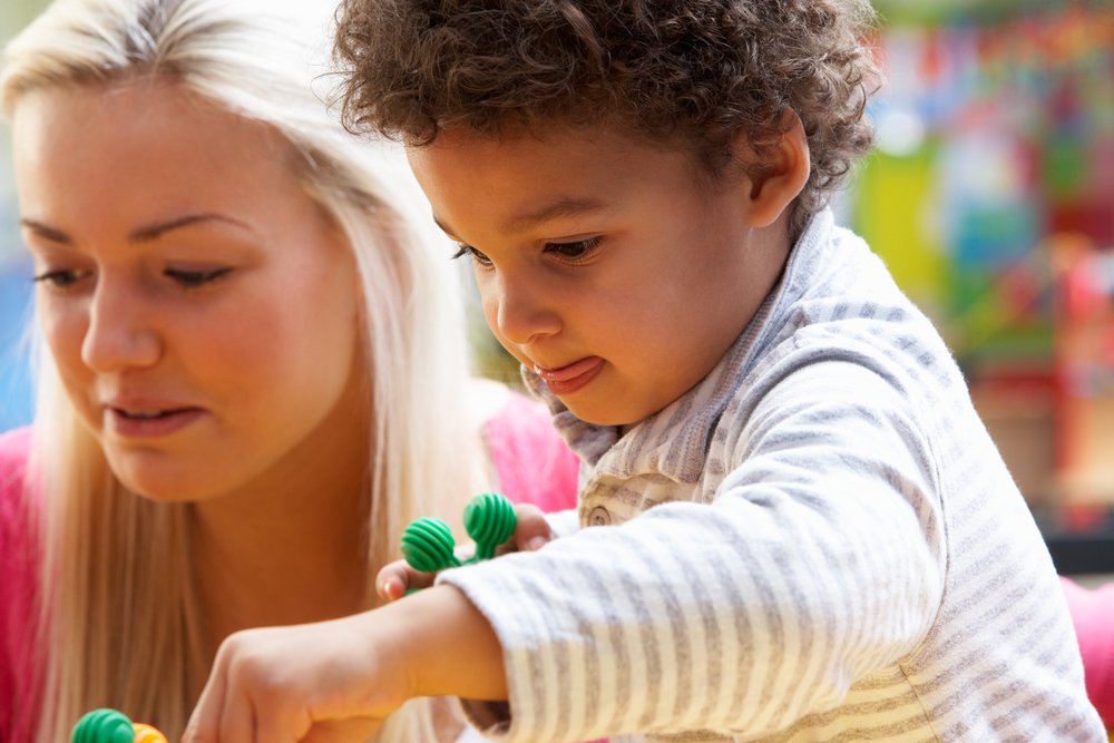 Lady playing with a child