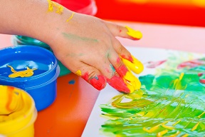 Child's hand doing finger painting