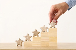 5 stars on wooden blocks increasing in height suggesting improvement